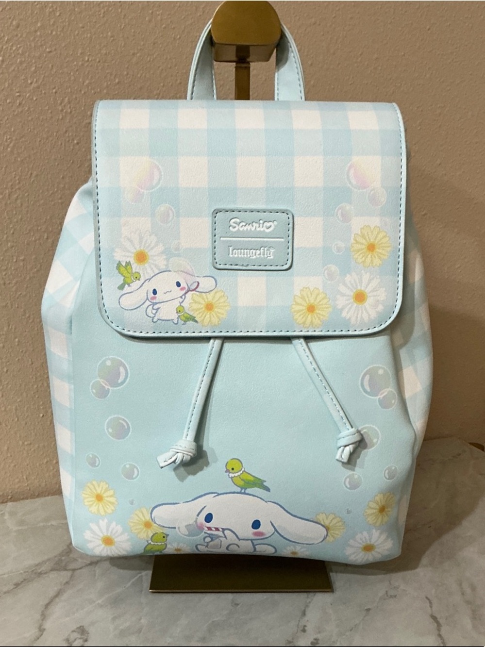 Loungefly Sanrio Cinnamoroll Daisy Gingham Slouch Mini Backpack.